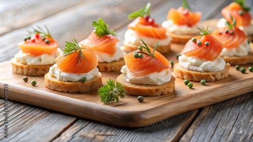 Delicious Smoked Salmon Canap?s with Cream Cheese and Herbs on Wooden Board