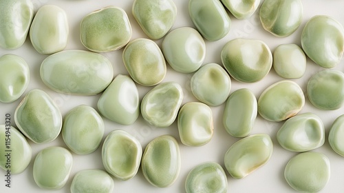 Marrowfat Peas (Pisum sativum): A group of large marrowfat peas in pale green tones, displayed on a plain white background photo