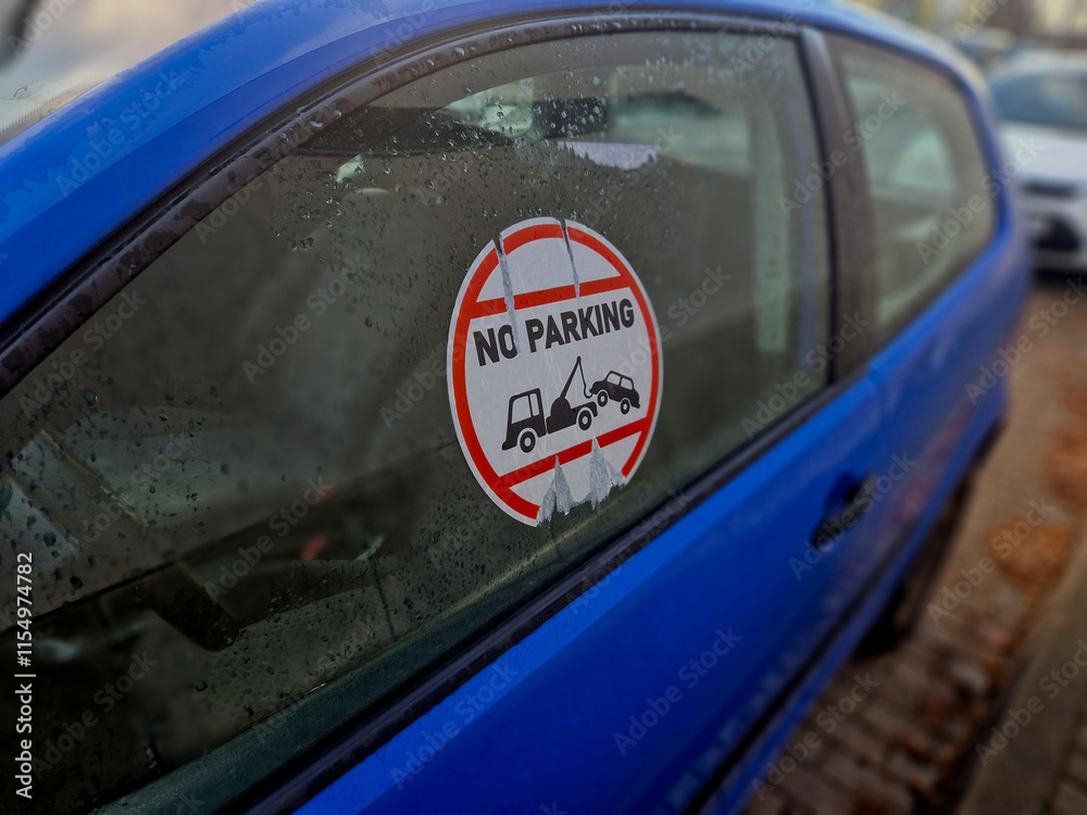 Obraz premium whoever prohibits parking on private land must use harsh methods. put a big sticker on the car window and discourage them from stopping at the entrance to the yard