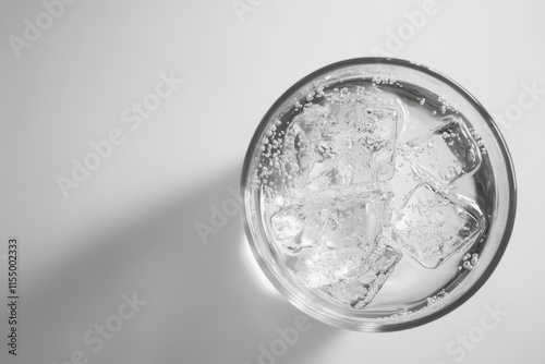 Sparkling water with ice in glass.