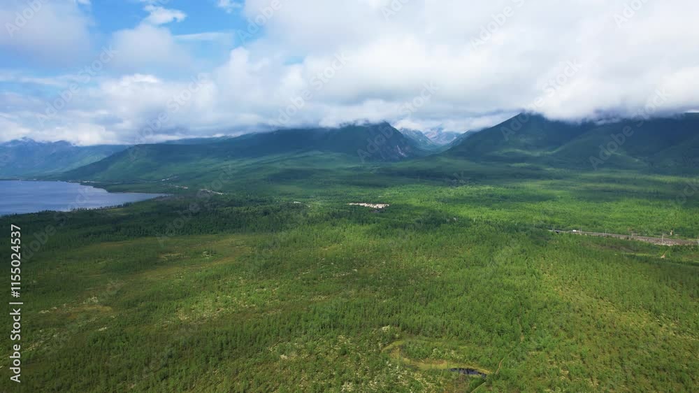 Side drone flight over lush green forest and mountains Side drone flight over lush green forest and mountains