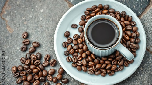 Medium roasted Arabica coffee beans arranged on a plate against a textured concrete stone background, tlo, stone background photo