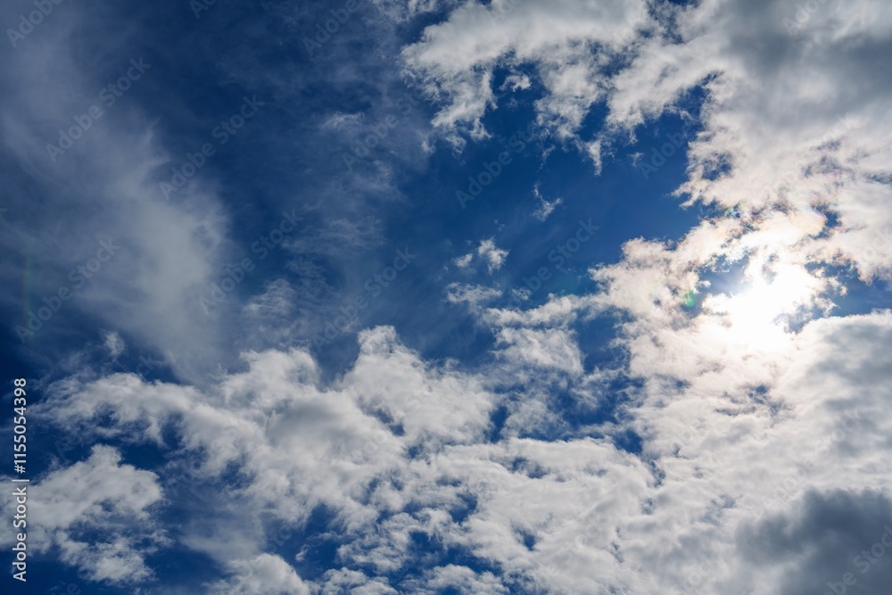 This captivating image features a vibrant blue sky filled with soft, fluffy white clouds, creating a tranquil and uplifting atmosphere. Ideal for backgrounds, presentations, or creative projects. This captivating image features a vibrant blue sky filled with soft, fluffy white clouds, creating a tranquil and uplifting atmosphere. Ideal for backgrounds, presentations, or creative projects.