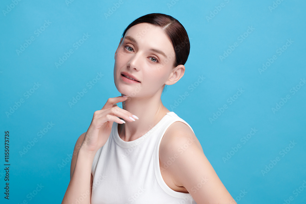Beautiful young woman with clean fresh skin on blue background, Face care, Facial treatment, Cosmetology, beauty and spa, women portrait. Beautiful young woman with clean fresh skin on blue background, Face care, Facial treatment, Cosmetology, beauty and spa, women portrait.