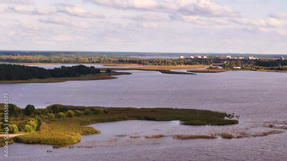 drone fly above Ķīšezers iake in Riga, Latvia, with primary inflow of the Jugla River, drone fly above Ķīšezers iake in Riga, Latvia, with primary inflow of the Jugla River,