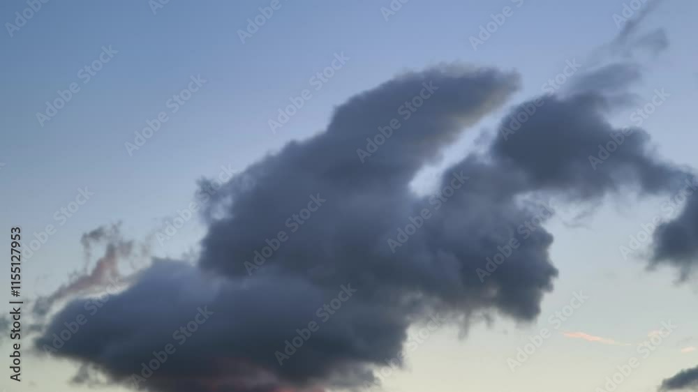 Blue and orange cumulus clouds move at dawn Blue and orange cumulus clouds move at dawn