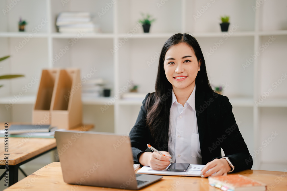 Asian business woman Working at the office with documents on the table Planning to analyze financial reports business plan investment financial analysis concepts Asian business woman Working at the office with documents on the table Planning to analyze financial reports business plan investment financial analysis concepts