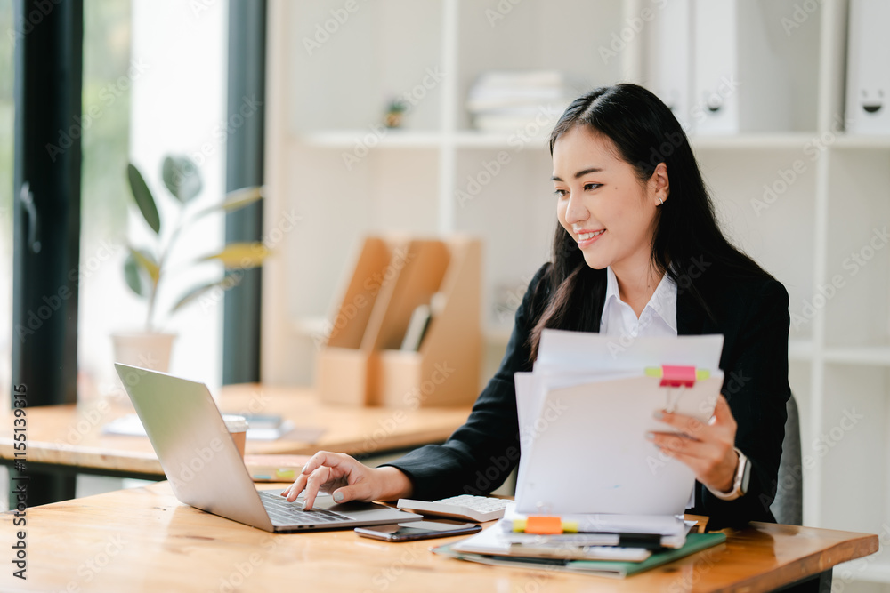 Asian business woman Working at the office with documents on the table Planning to analyze financial reports business plan investment financial analysis concepts Asian business woman Working at the office with documents on the table Planning to analyze financial reports business plan investment financial analysis concepts