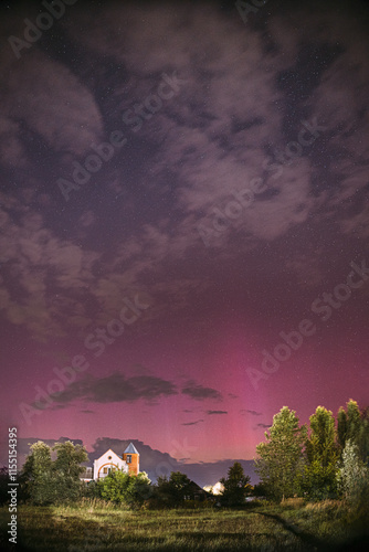 Obraz na płótnie Aurora borealis Amazing Night Starry Sky above summer country landscape. Bright Dramatic Perseids meteors Trails Of Stars And Meteors. Sky In Different Colors. From Dusk Till Dawn. Misty Night. w salonie