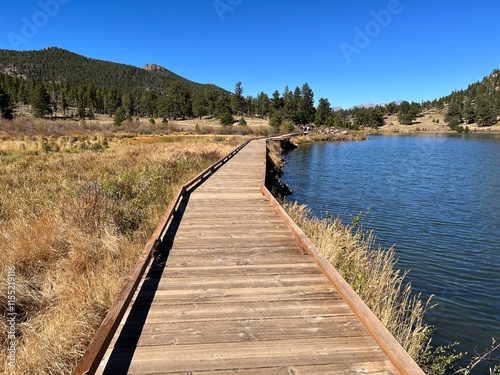 Wooden walkway along the Lily lake, Estes Park, Colorado photo