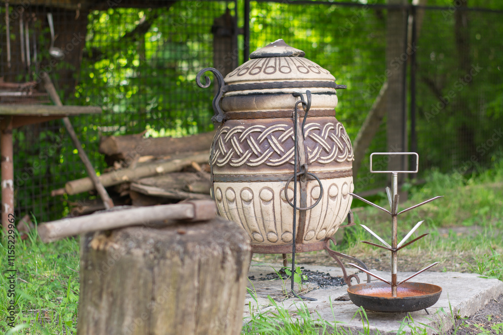Tandoor stand in a lush outdoor setting Tandoor stand in a lush outdoor setting