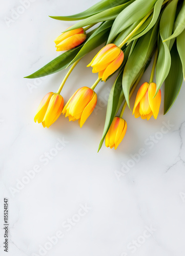 Beautiful yellow orange tulips on light stone background. Mother day, easter, wedding greeting card