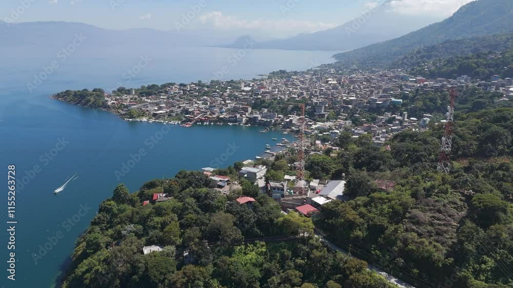 High view over the town of San Juan de la Laguna on the shores of Lago Atitlan, under a sunny day with a clear blue sky High view over the town of San Juan de la Laguna on the shores of Lago Atitlan, under a sunny day with a clear blue sky