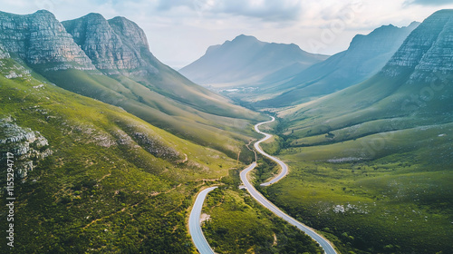 Scenic aerial view of Oudekraal Nature Reserve in Cape Town highlighting a winding road amid rugged mountain landscapes photo