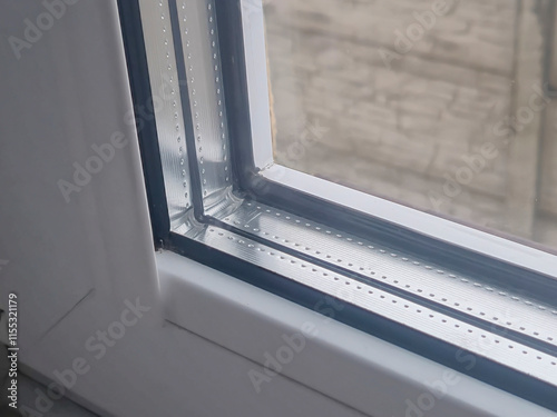 Close-up view of a modern window showcasing its sleek design and craftsmanship. Ideal for home improvement references and architectural discussions. photo