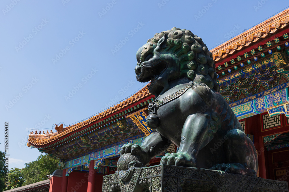 Fototapeta premium The cloud gate and bronze lion statue at the Summer Palace in Beijing, China