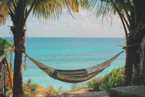 A tranquil scene of a hammock strung between two palm trees overlooking a calm, turquoise ocean, capturing the peace and serenity of a tropical paradise escape.