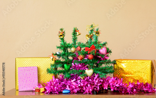 Small Christmas Tree with Decorative line and Gift Boxes on Table