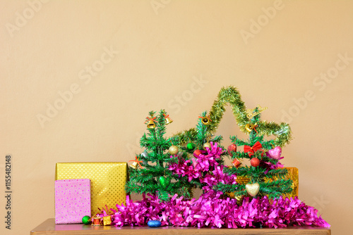 Small Christmas Tree with Decorative line and Gift Boxes on Table