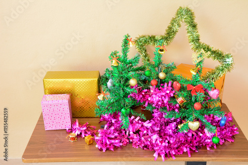 Small Christmas Tree with Decorative line and Gift Boxes on Table