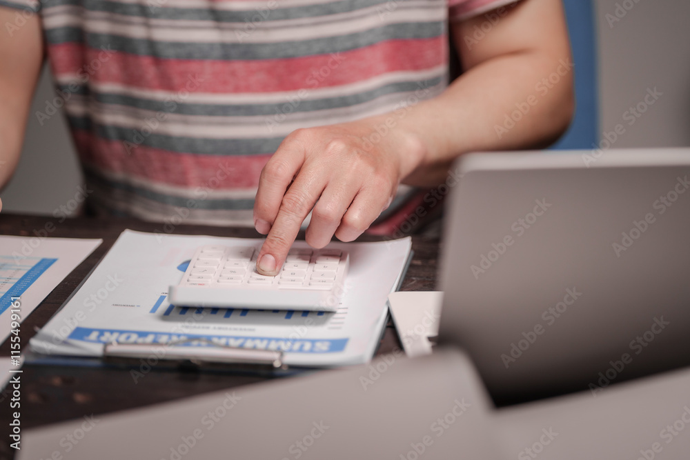A man sits at his desk at home at night, working on his laptop. He views charts, checks documents, and analyzes financial data, focusing on investments, stock trading, and shareholder rights A man sits at his desk at home at night, working on his laptop. He views charts, checks documents, and analyzes financial data, focusing on investments, stock trading, and shareholder rights