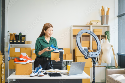 A beautiful Asian woman shares her journey of selling shoes via live camera on social media from home. As an influencer vlogger and SME retail store owner, she successfully markets clothes online