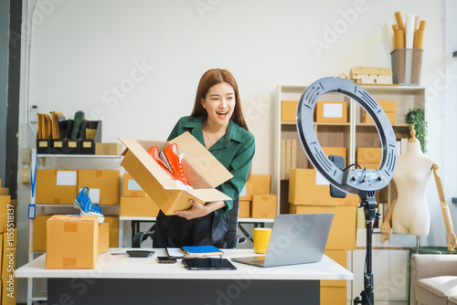 A beautiful Asian woman shares her journey of selling shoes via live camera on social media from home. As an influencer vlogger and SME retail store owner, she successfully markets clothes online