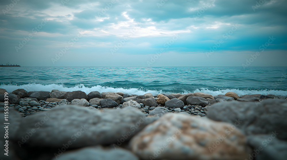 Serene coastal scene featuring a rocky shore and tranquil turquoise sea under a cloudy sky. Perfect for travel, nature, or relaxation themes. Serene coastal scene featuring a rocky shore and tranquil turquoise sea under a cloudy sky. Perfect for travel, nature, or relaxation themes.