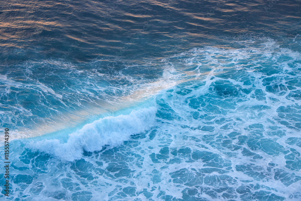 Blue and turquoise clean ocean crashing wave. Natural tropical oceanic water beauty in sunset light Blue and turquoise clean ocean crashing wave. Natural tropical oceanic water beauty in sunset light