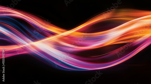 Colorful light trails create an abstract display of movement and energy in a dark background