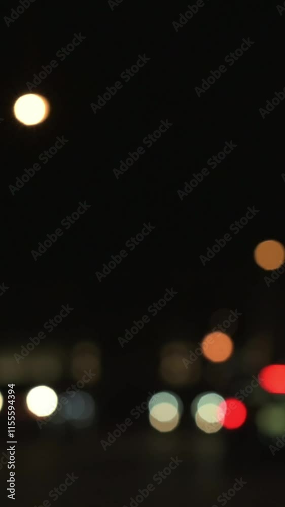 Blurred Night Lights with Full Moon in Background artistic bokeh shot of blurred city lights at night with glowing full moon in dark sky, creating dreamy and atmospheric mood. vertical Blurred Night Lights with Full Moon in Background artistic bokeh shot of blurred city lights at night with glowing full moon in dark sky, creating dreamy and atmospheric mood. vertical