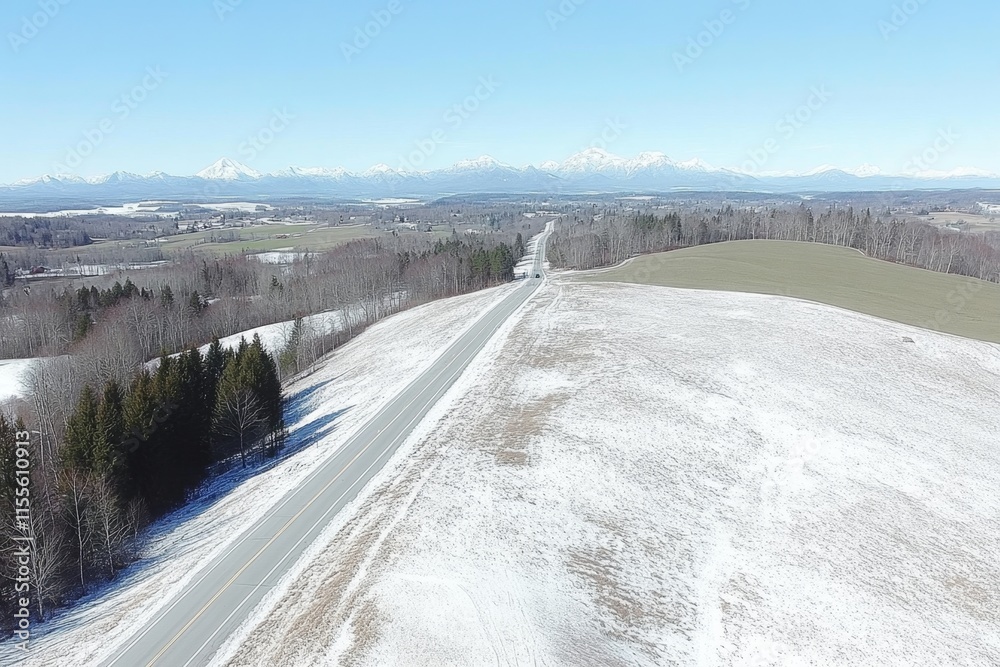 A wide highway with electric car charging stations along the sides, surrounded by green fields under a clear sky A wide highway with electric car charging stations along the sides, surrounded by green fields under a clear sky