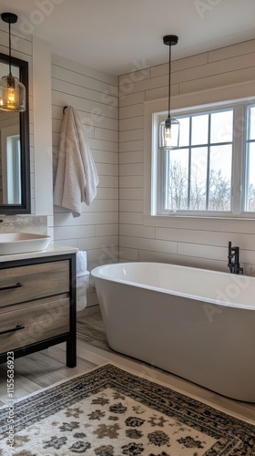 Modern bathroom design featuring a freestanding tub and elegant vanity with n...