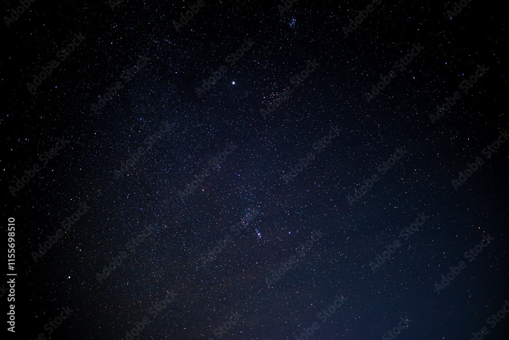 Fototapeta premium The sky is a vast expanse above us, home to countless stars that twinkle like distant beacons of light.
