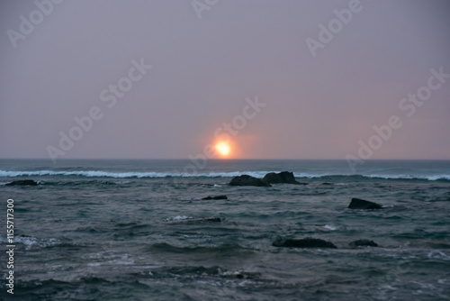 Gorgeous sunset with rain and clouds as a cyclone passes through Mauritius Island photo