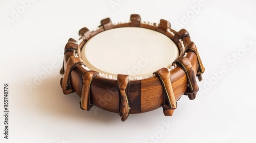 Wooden tambourine on white background showcasing handcrafted details and texture suitable for music and cultural themes. photo