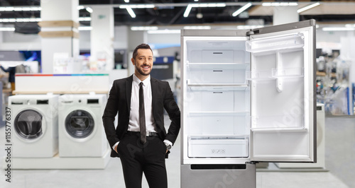 Wallpaper Mural Businessman leaning on a fridge Torontodigital.ca