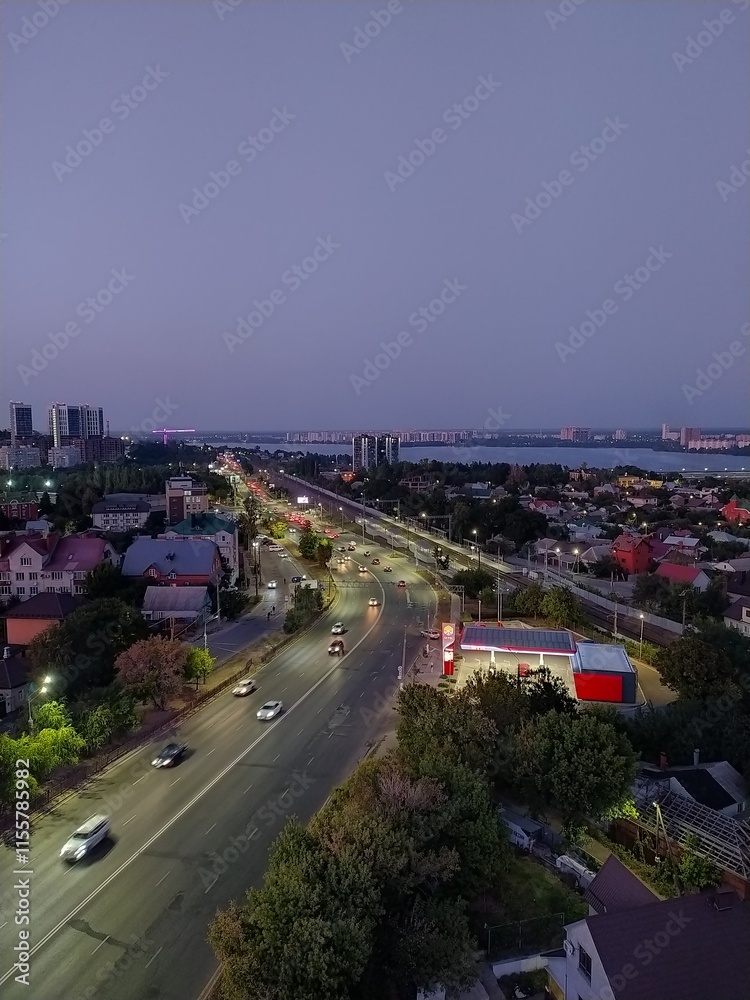 Fototapeta premium Aerial view of the road in the city at night. Top view