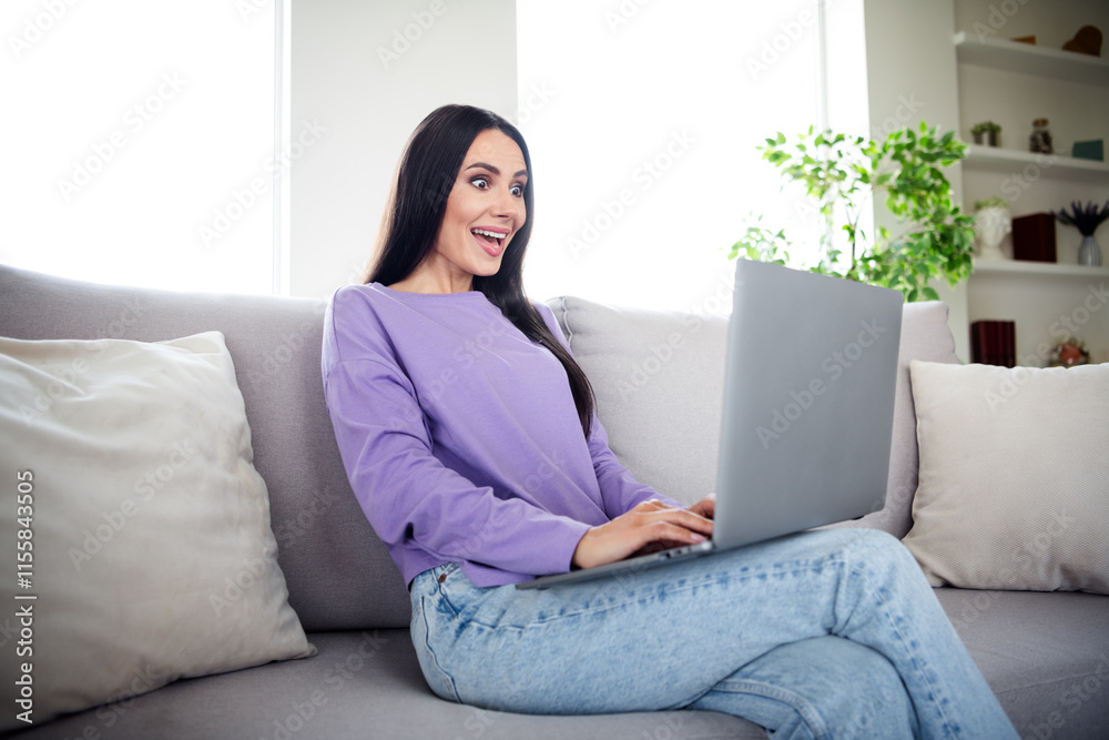 Young woman enjoying a relaxing weekend at home with a laptop in a cozy apartment setting Young woman enjoying a relaxing weekend at home with a laptop in a cozy apartment setting