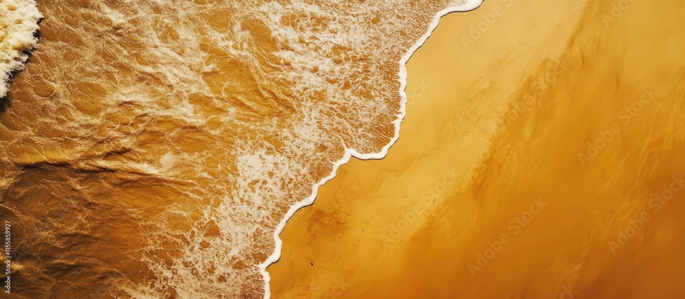 Aerial view of a sandy beach with waves gently lapping at the shore creating a serene and tranquil coastal landscape. Aerial view of a sandy beach with waves gently lapping at the shore creating a serene and tranquil coastal landscape.