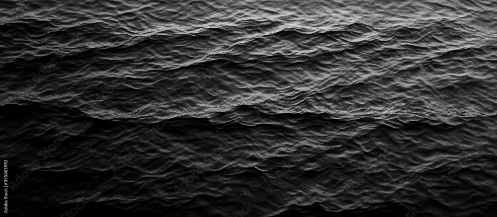 Aerial view of dark ocean waves creating a textured pattern with ample negative space for overlaying text or graphics Aerial view of dark ocean waves creating a textured pattern with ample negative space for overlaying text or graphics