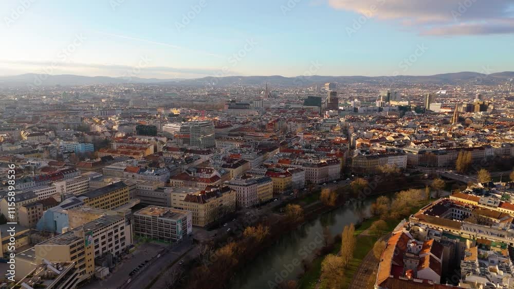 Vienna, Austria Aerial View: Sunset Over City Center and Canal. Top cinematic aerial view. 4K drone footage Vienna, Austria Aerial View: Sunset Over City Center and Canal. Top cinematic aerial view. 4K drone footage
