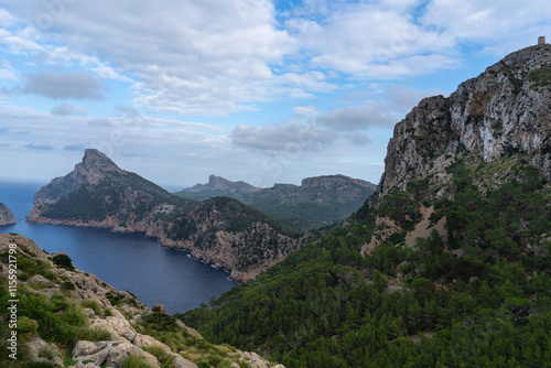 Cap de Formentor, Mallorca, Spain 25.10.2021 - Panoramic view of coastline with pine forest and Mediterranean mountain range