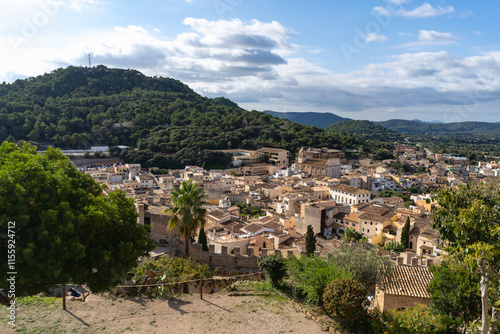 Capdepera, Mallorca, Spain 26.10.2021 Aerial view of Mediterranean village with church tower nestled between green mountains