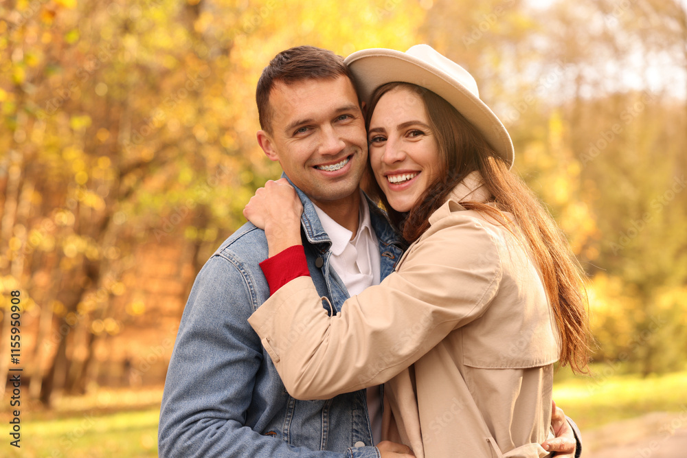 Fototapeta premium Happy couple spending time together in autumn park