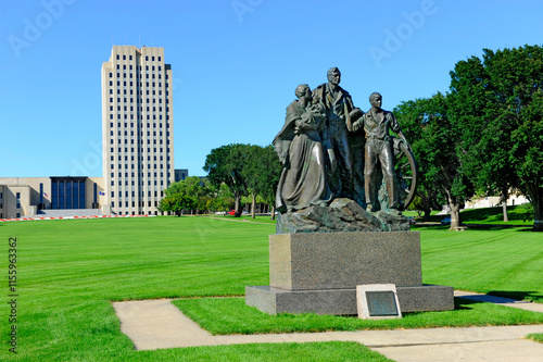 North Dakota State Capitol Building in Bismarck ND.The Pioneer Family Statue was sculpted by Avard Fairbanks and donated in 1946. photo