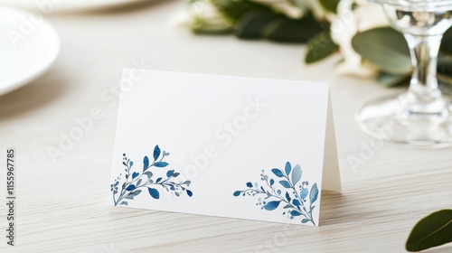 Elegant wedding place cards with blue watercolor floral design for spring celebrations