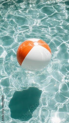 Colorful beach ball floating in clear water on a sunny day during summer fun