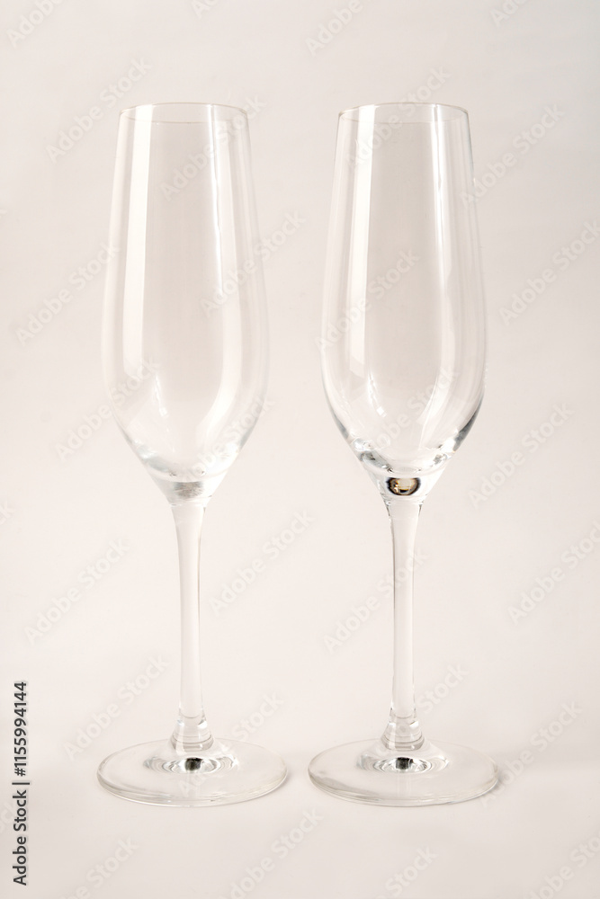 empty champagne glasses on a light background empty champagne glasses on a light background