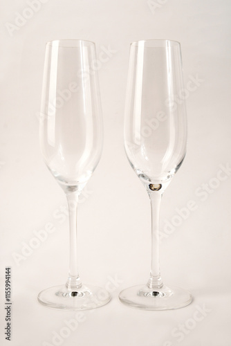 empty champagne glasses on a light background